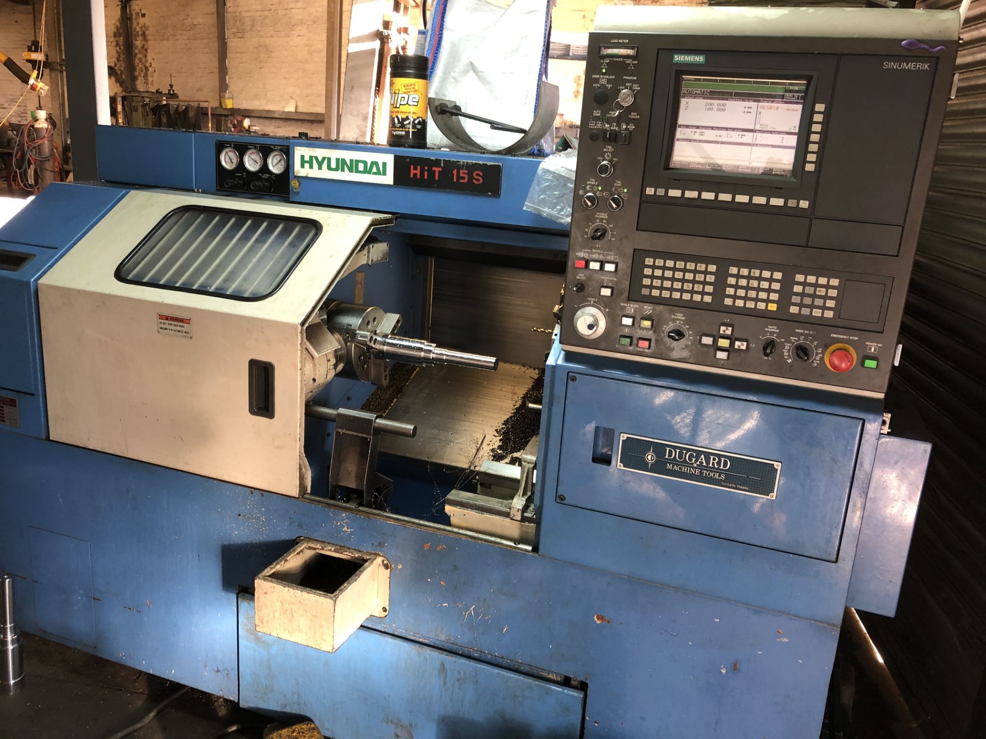 * Hyundai HiT 15S 8 Station CNC Lathe A 1997 Hyundai Model HiT 15S 8 Station CNC Lathe with tool