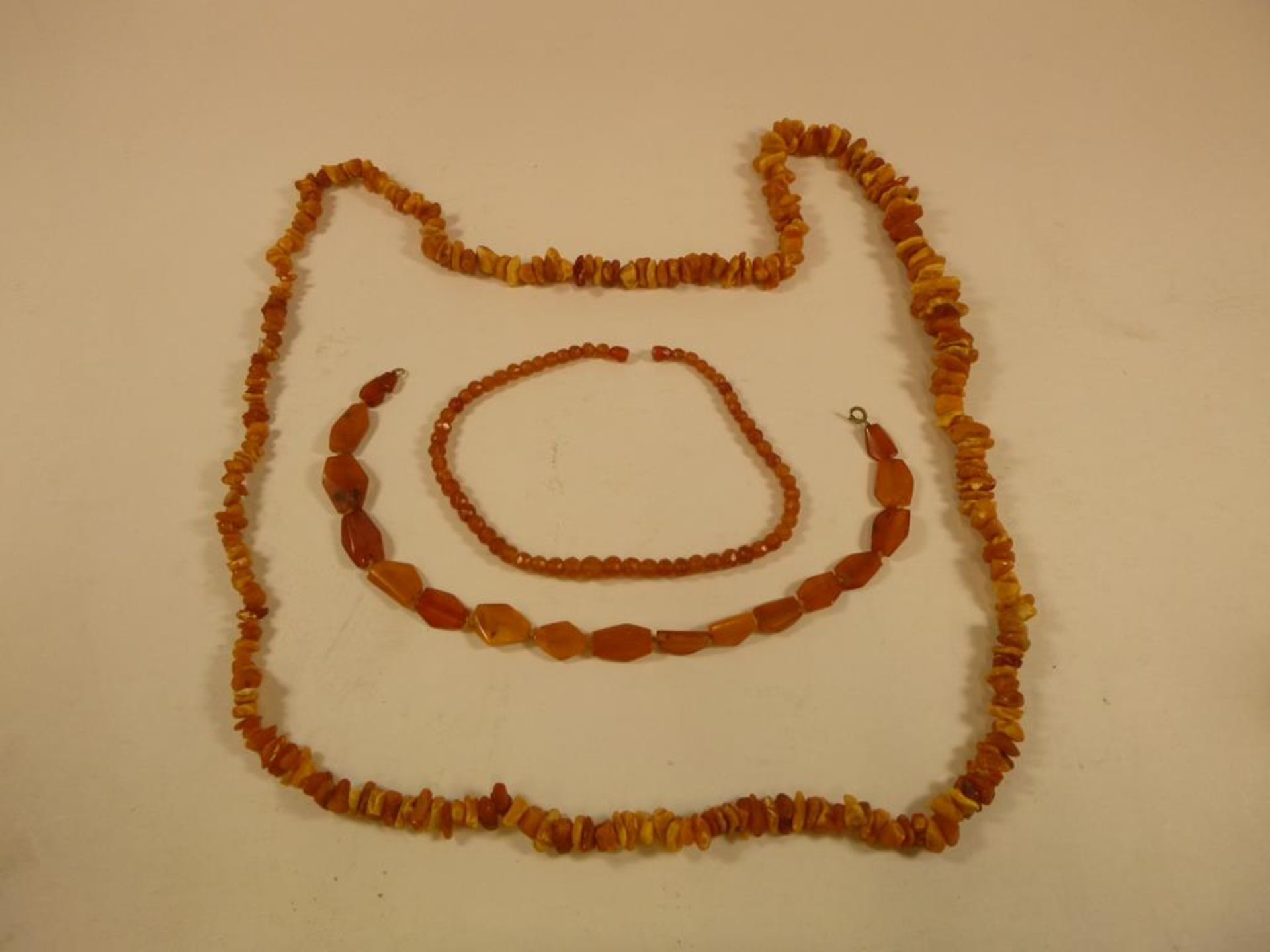 Three Strings of Natural Amber Beads (approx 160g) (est £45-£90)