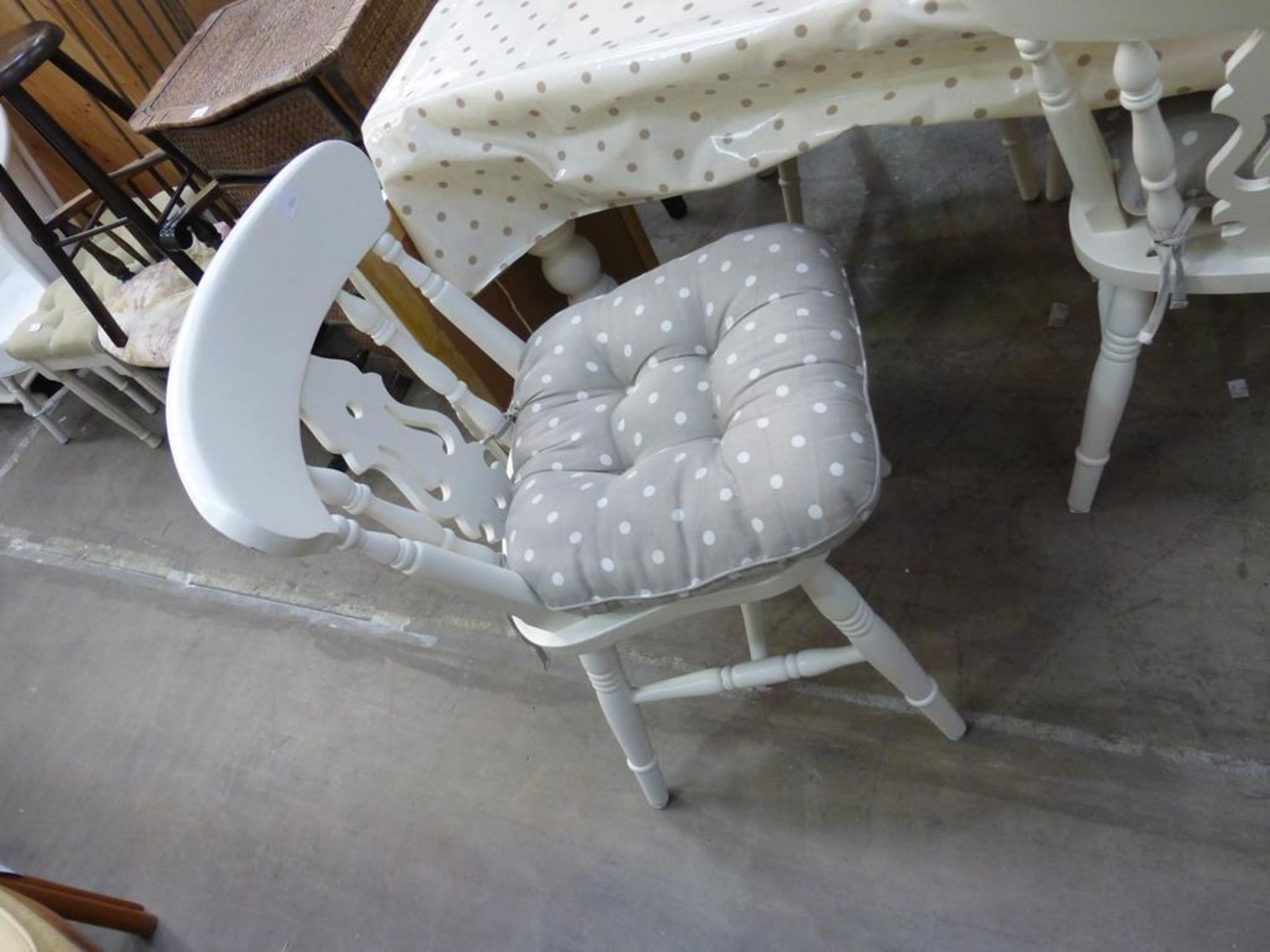 A white painted Victorian Style Breakfast Table together with a set of four white painted spindle