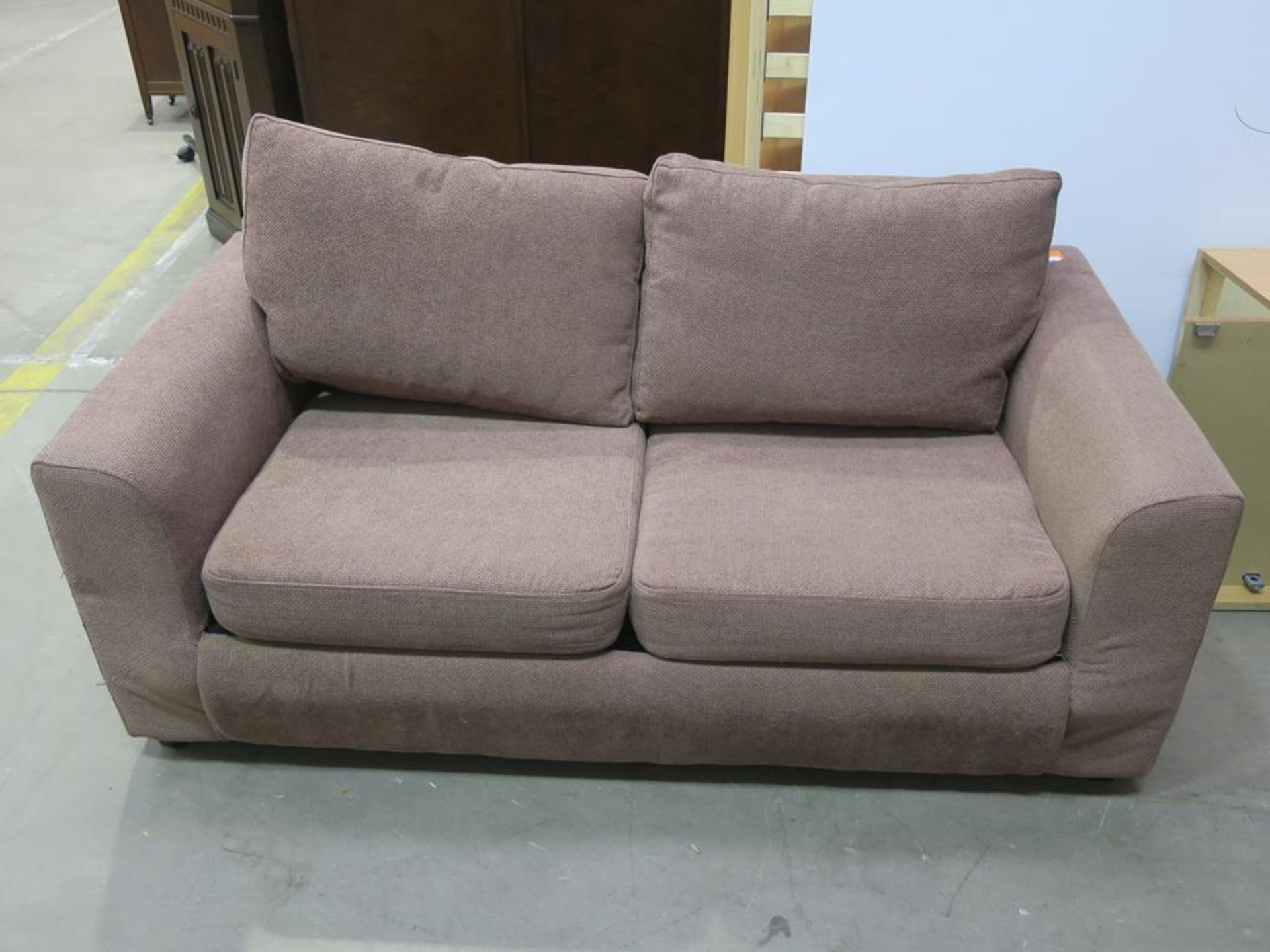 A two seater Bed Settee with a brown weave style upholstery (est £50-£100)