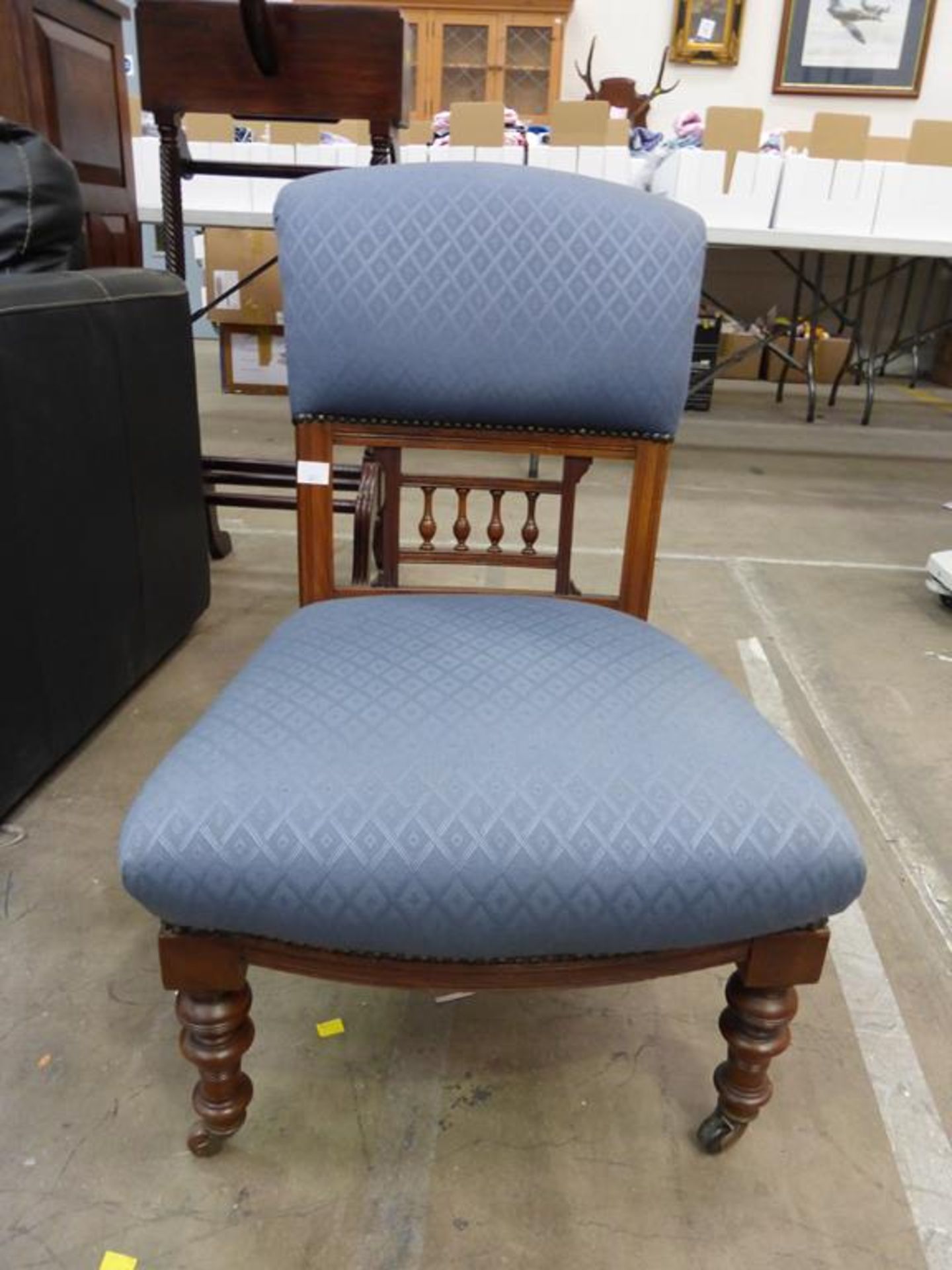 A Late Victorian Walnut Nursing Chair with upholstered back and seat on turned front legs (est £ - Image 2 of 3