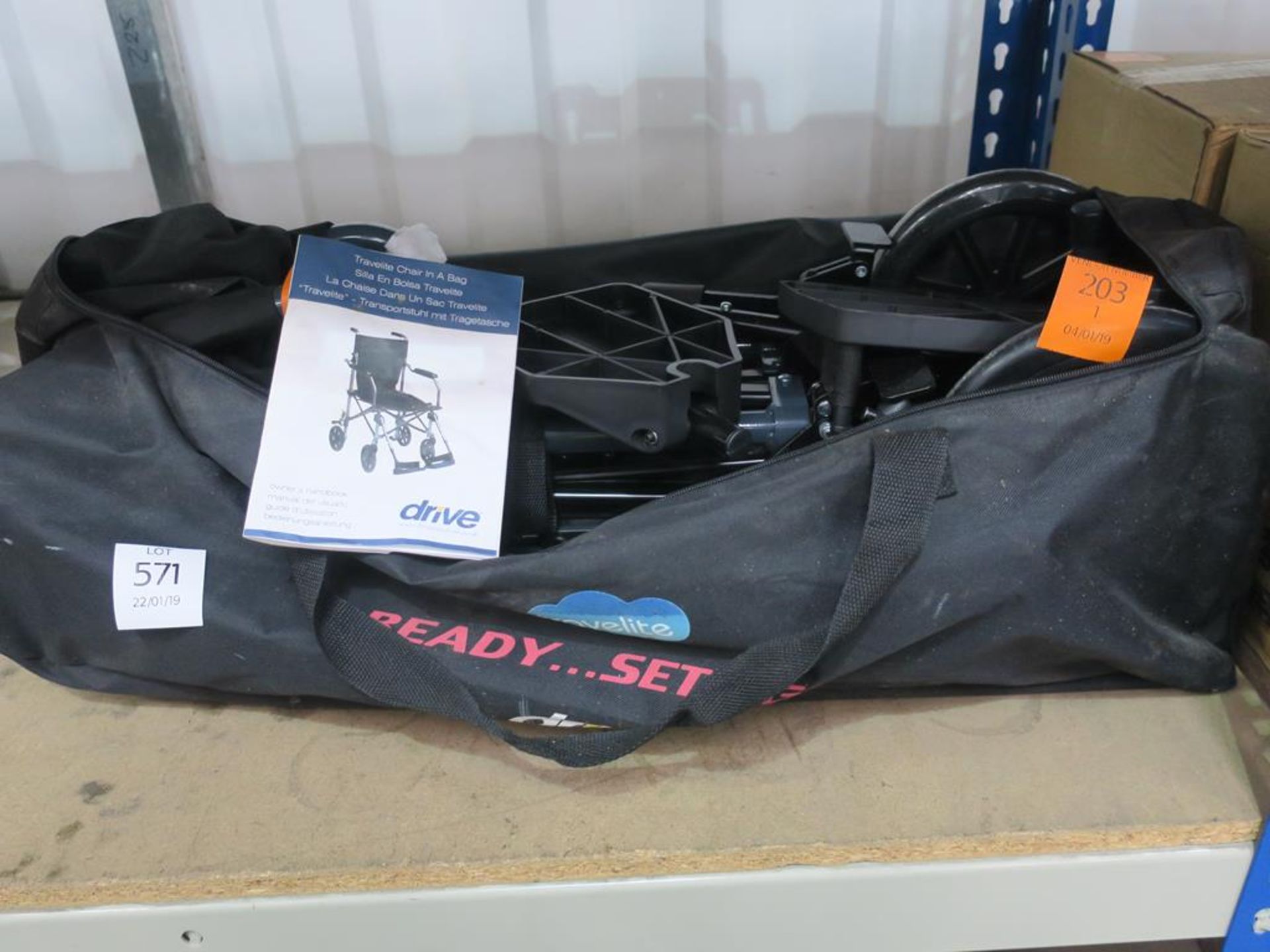 A Drive-Medical Travelite Chair in a Bag