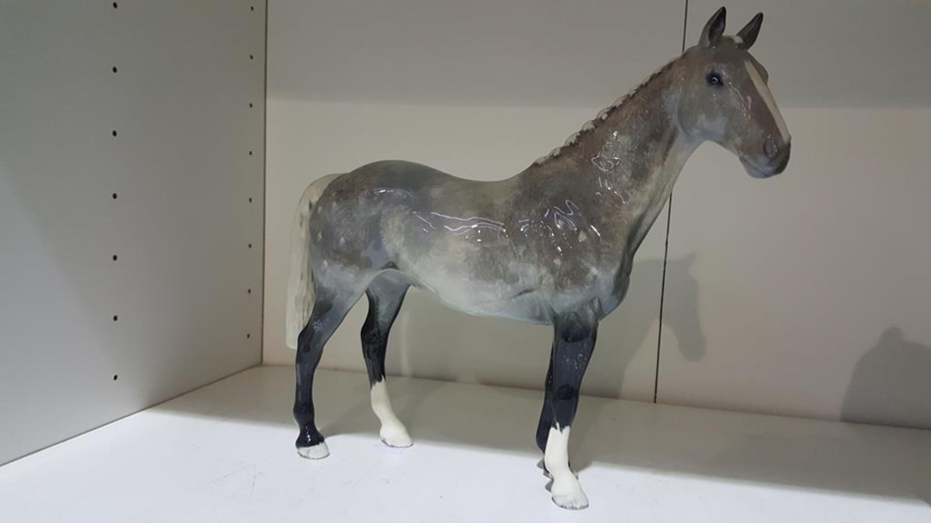 A Grey Beswick Horse (est £20-£40)