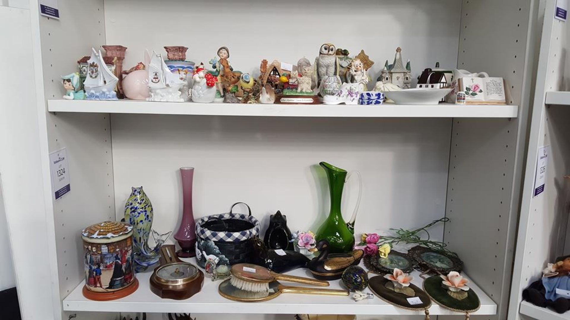 Two shelves of miscellaneous items including a Beswick Bluetit, 'Summer Haze' by Lilliput Lane,