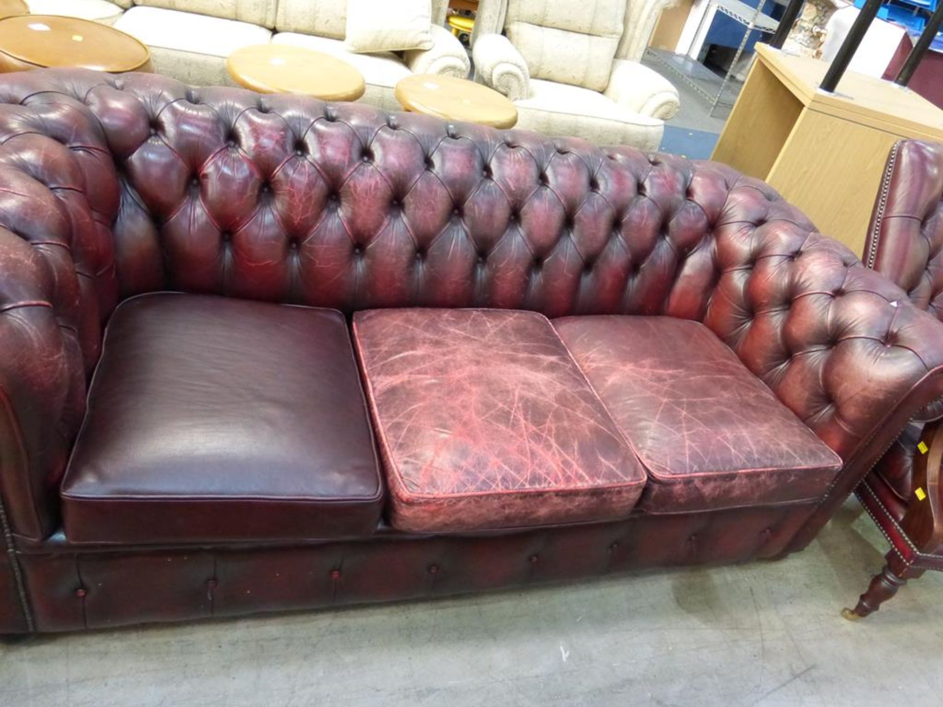 A red leather upholstered Chesterfield Three Seater Sofa (est £100-£200) - Image 2 of 2