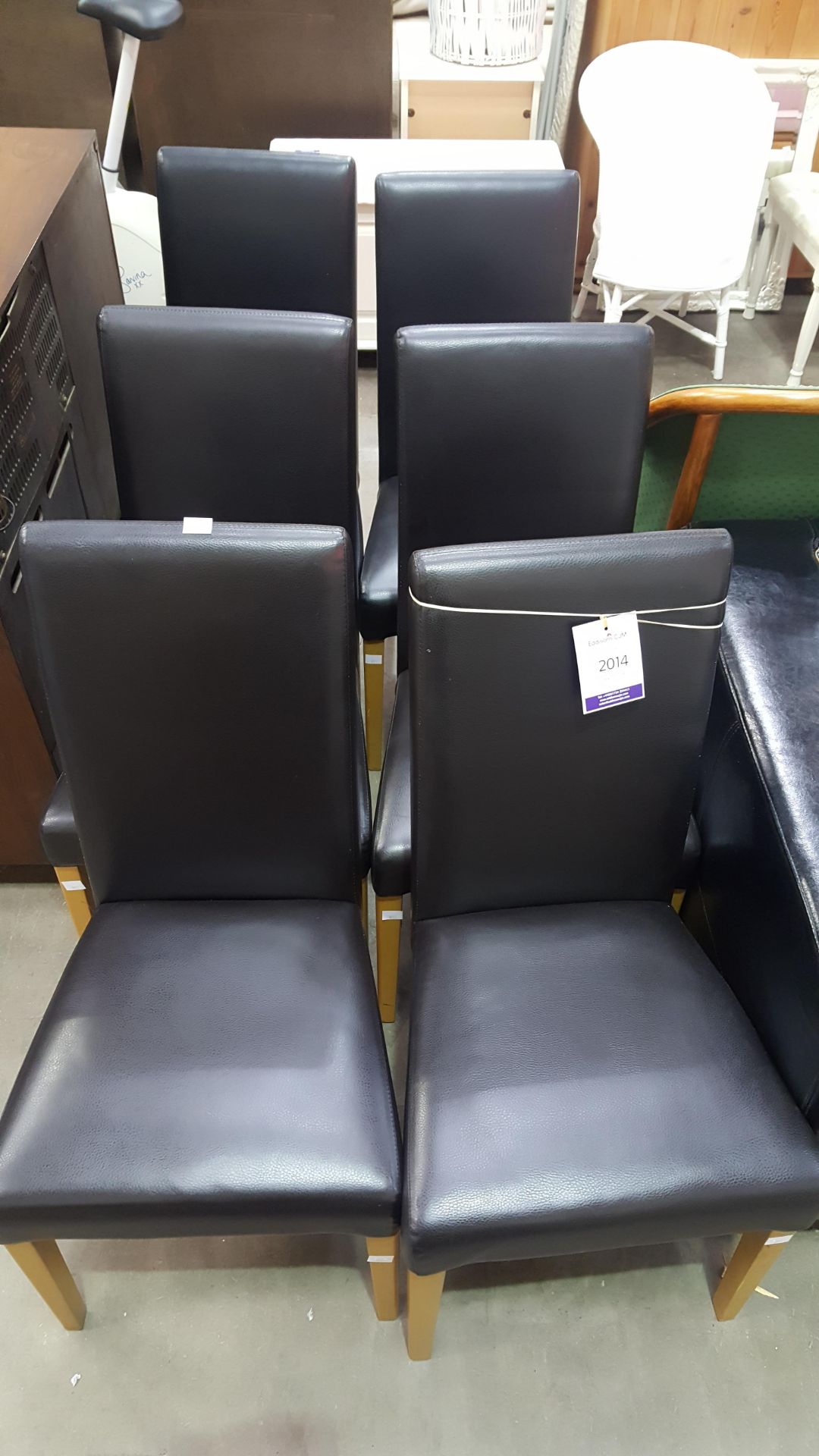 A set of six black faux leather upholstered high back Single Dining Chairs (est £60-£100)