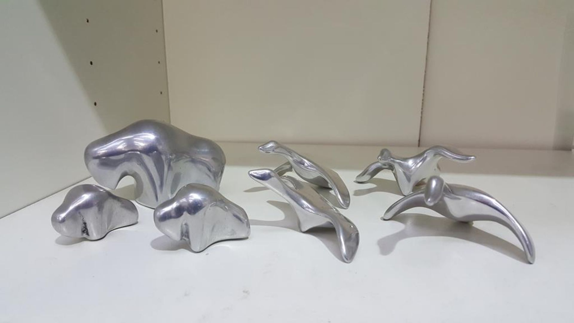 Seven Hoselton Stainless Steel Miniatures including Four Geese Figures and Three Buffalo Figures (