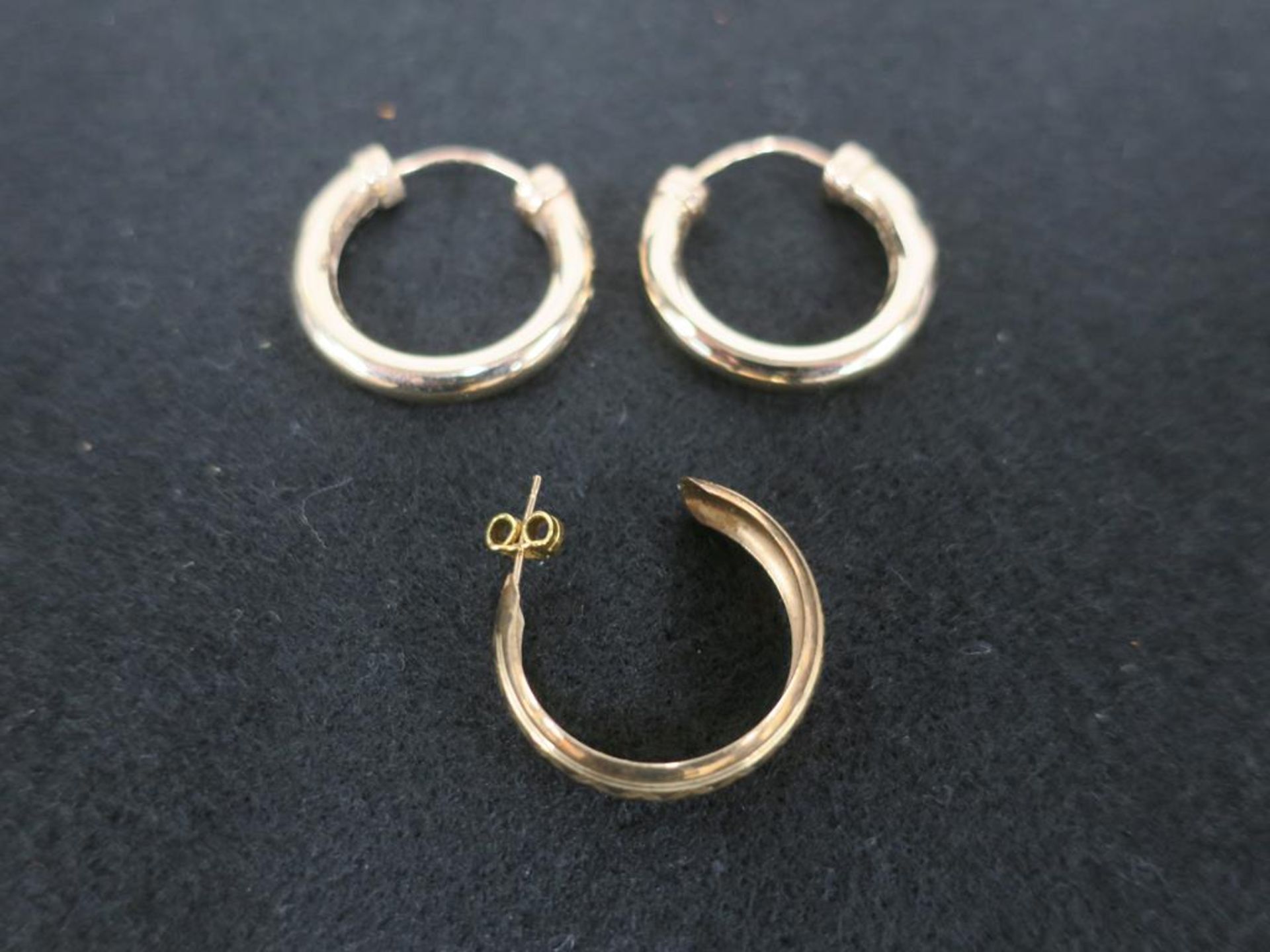 A Pair of 9ct Gold Earrings and a Single Earring With Gold Clip (est £20-£40)
