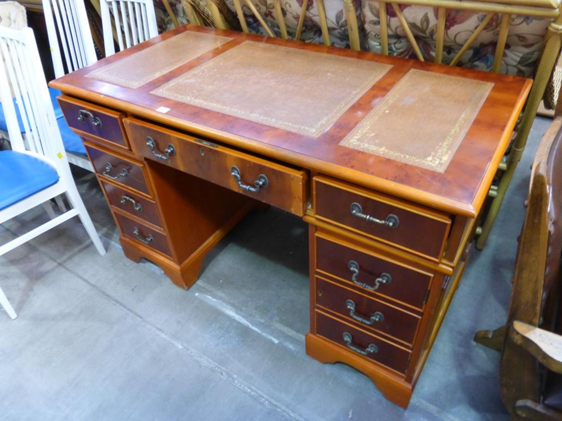 A Reproduction Yew Wood Pedestal Desk with inset Leather Writing Surfaces, Three Frieze Drawers