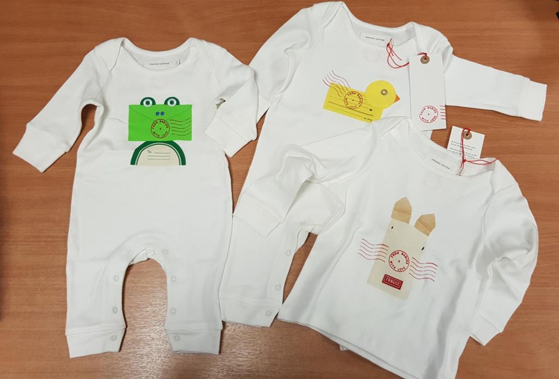 Qty of Children's T-shirts and All in Ones made from organic cotton by 'From Babies with Love',