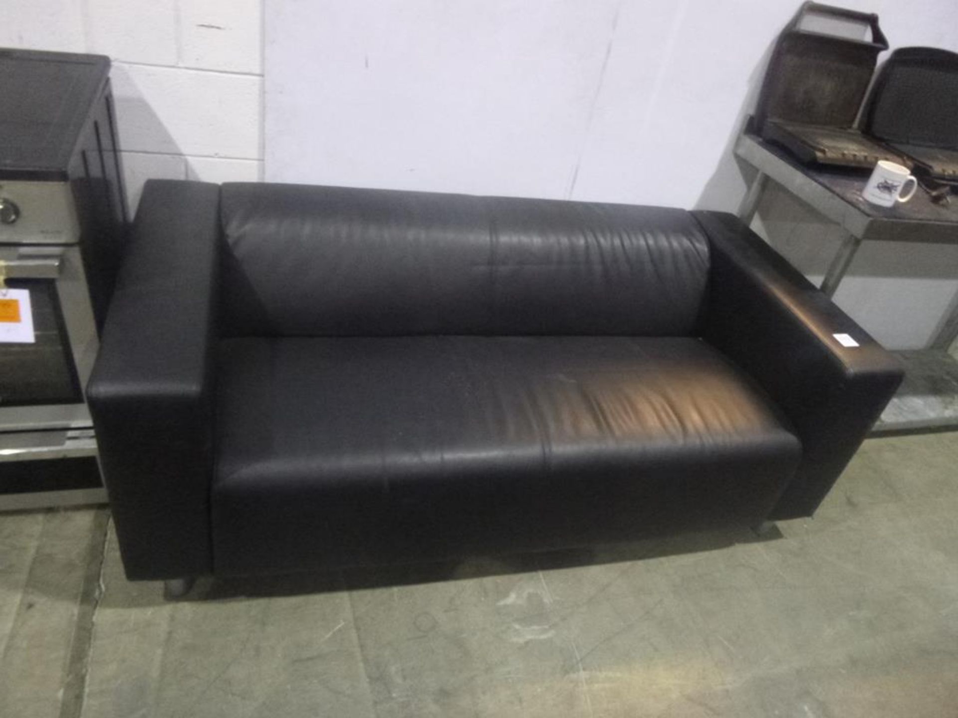 * A 2 Seater Black Sofa