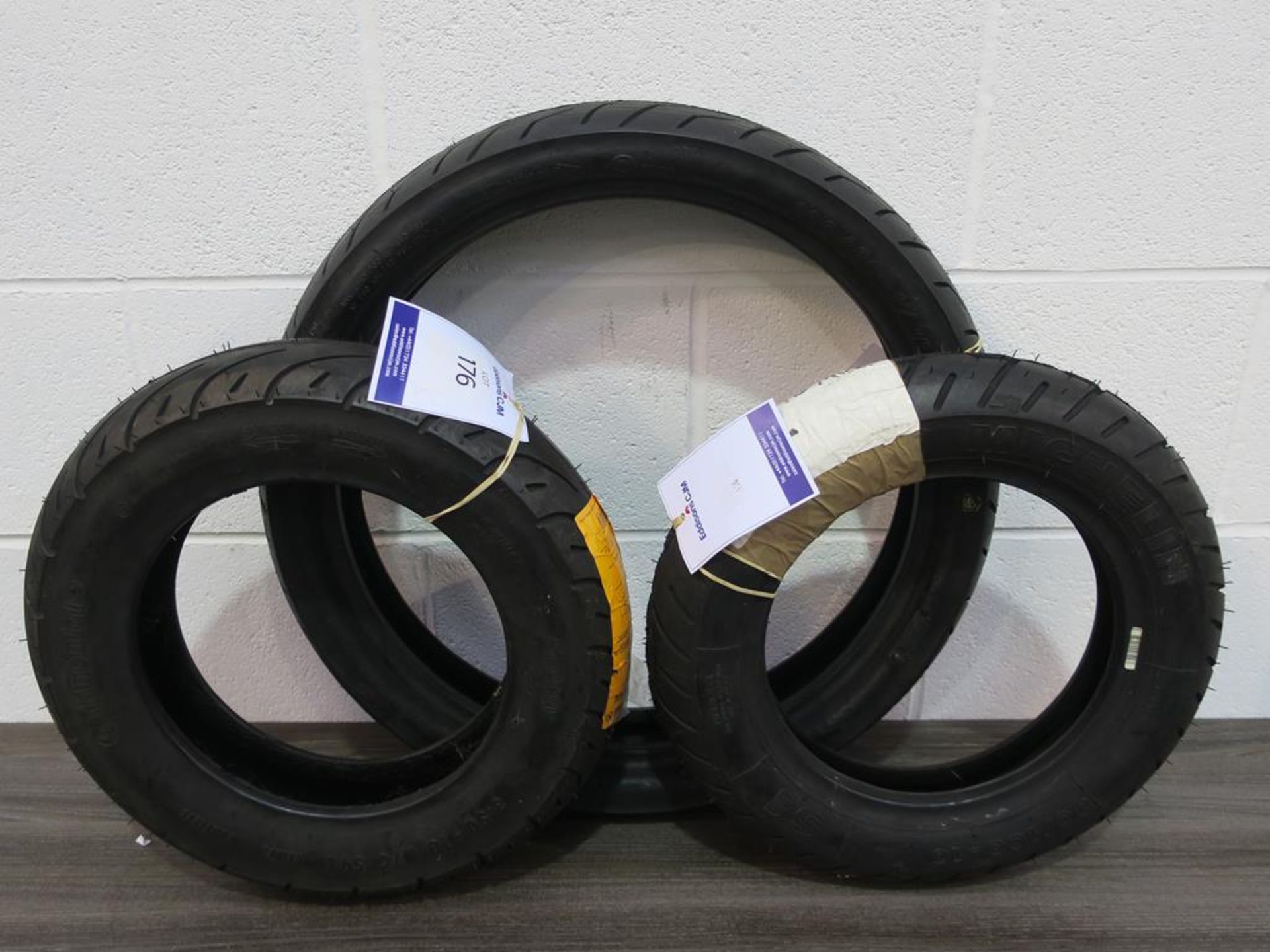 * A MAG Sport CST 100/80-17 Motorcycle 52H Tyre together with a Continental Scooty 3.50-10