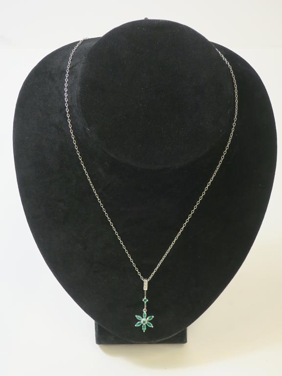 This is a Timed Online Auction on Bidspotter.co.uk, Click here to bid. A Silver, Emerald and Diamond