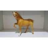 This is a Timed Online Auction on Bidspotter.co.uk, Click here to bid. A Palomino Beswick Horse (est
