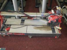 * Rubi DC 250 1200 110V Tile Cutter. Please note there is a £10 Plus VAT Lift Out Fee on this lot