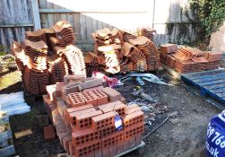 Assortment of building materials, including bricks