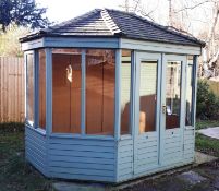 Cedar wood extended octagonal summerhouse, with cedar roof and glazed windows. RRP £8,000. *