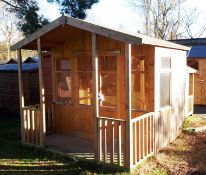 8ft x 6ft Summerhouse with veranda, felt tiled roof and glazed windows. RRP £1,500. *Purchaser