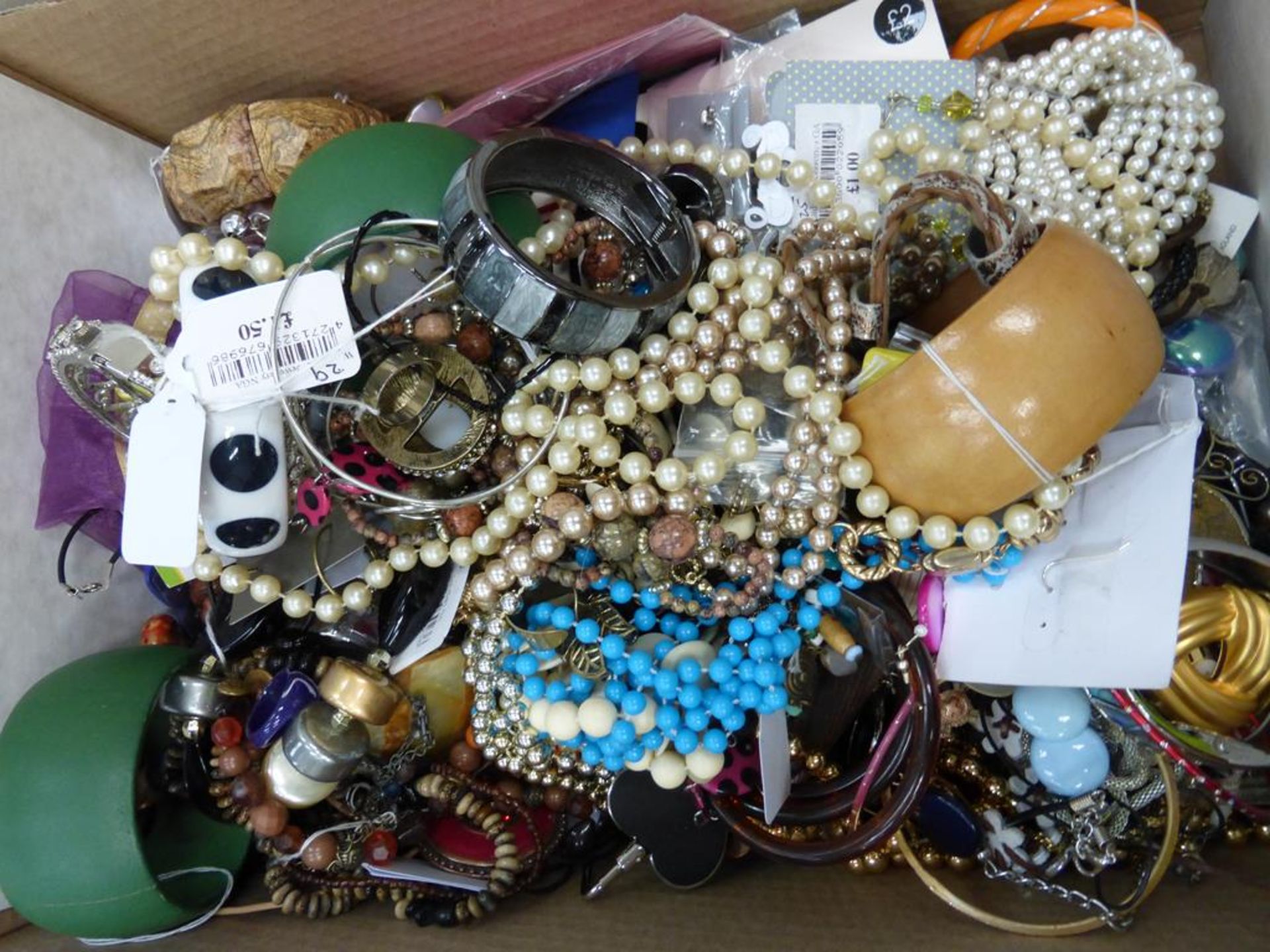 A box of Costume Jewellery. This lot is being sold on behalf of a charity without reserve or