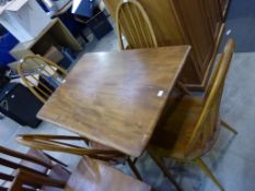 An Ercol Lightwood Finish Rectangular Dining Table on Turned Splayed Legs 97cms together with a