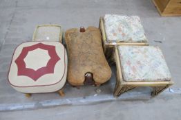 A Camel Stool, a Pair of Canework Footstools and two others (£20-£30)