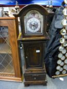 * A miniature size Longcase Clock with Battery Powered Movement within an Ornate Case