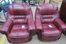 A pair of Red Leather Armchairs - Chateau D'Ax (est £100-£150)