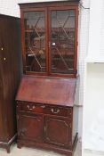 * A Reproduction Mahogany Bureau Bookcase in the Regency Design with glazed Astragal Doors to the