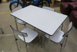 A 1960's Formica Dining Table and Four Matching Chairs (est £40-£80)