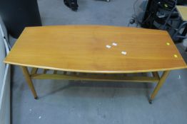 An Ercol Style Coffee Table on Castors with Slatted Undertier (est £25-£50)