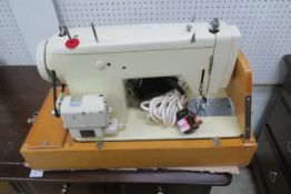 An Electric Frister + Rossmann Sewing Machine Model 45 Mark II with cover (est £20-£40)