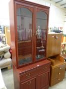 A modern tall Display Cabinet with glazed doors to the top over one drawer and two cupboards (77cm