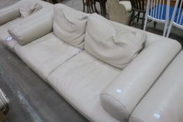 A Large Plain Fawn Leather Three Seat Settee (est £100-£200)