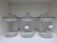 A set of six Large Clear Glass Lidded Storage Jars (est £20-£30)