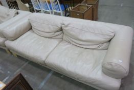 A Large Plain Fawn Leather Three Seat Settee (est £100-£200)