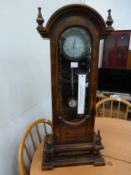 * A Miniature size Longcase Clock with Battery Powered Movement within an Ornate Case with Domed Top