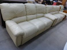 A Pair of Cream Leather Double Recliner Three Seater Sofas (est £80-£150)