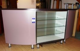 Wooden reception counter with glass shelf, and gla