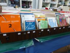 Five divided shelves of music literature to include ''Guitar Grade 2 Rock School'', ''Gilbert