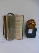 * A used Casali Verona Italian Piano Accordion in Pink Onyx Finish with matching stamps to keyboard,