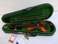 * An Antoni 1/8 Violin Outfit housed in a fitted hard case (RRP £59)