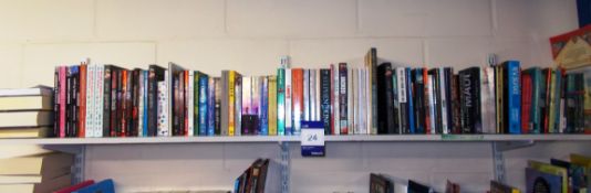 Assortment of books to shelf including literature,