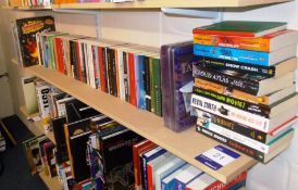 Assortment of books to shelf including literature,