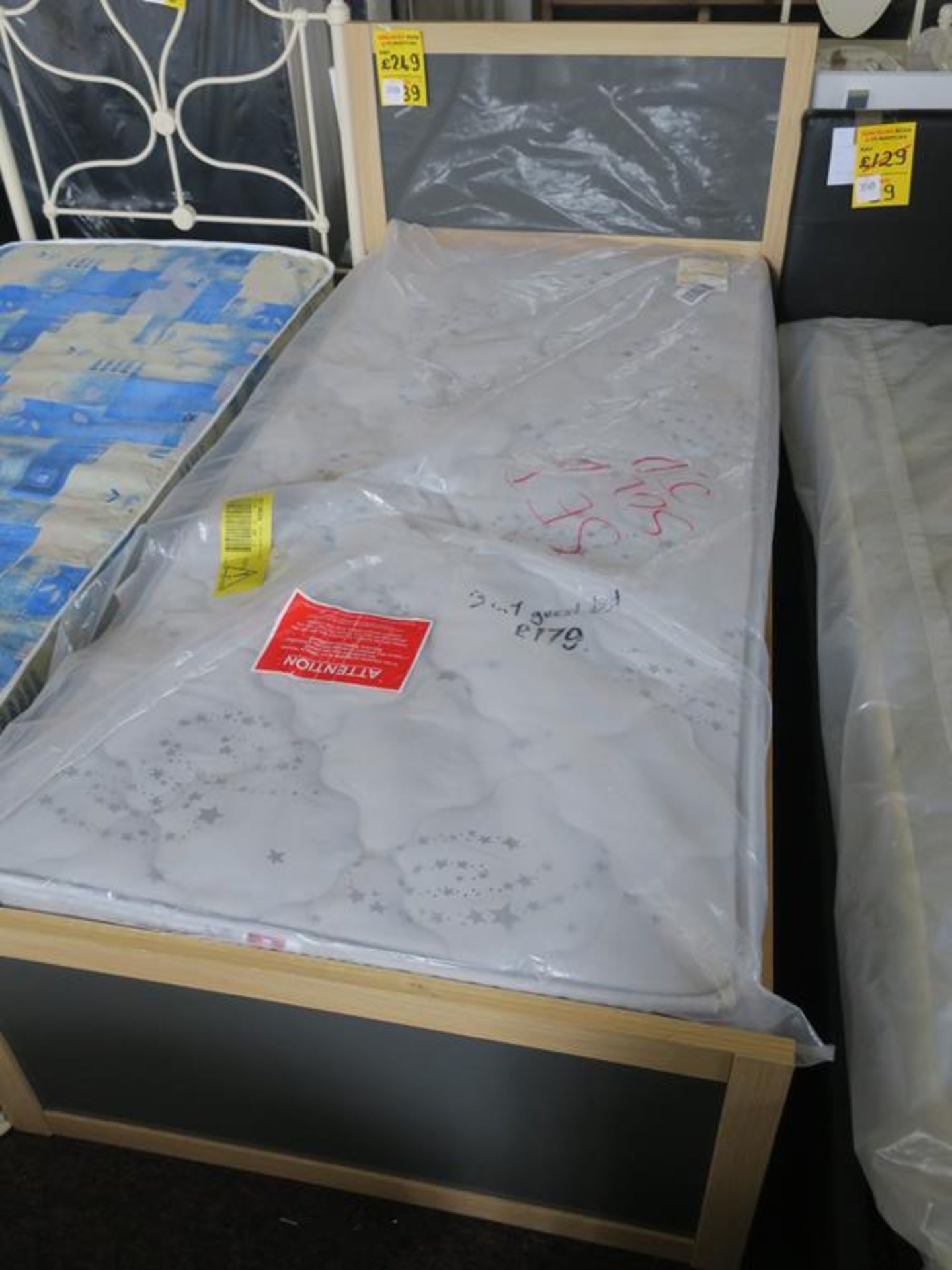* A Strada Single Bed Frame Together with a Single Mattress