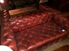 Back to back red leather Chesterfield style sofa,
