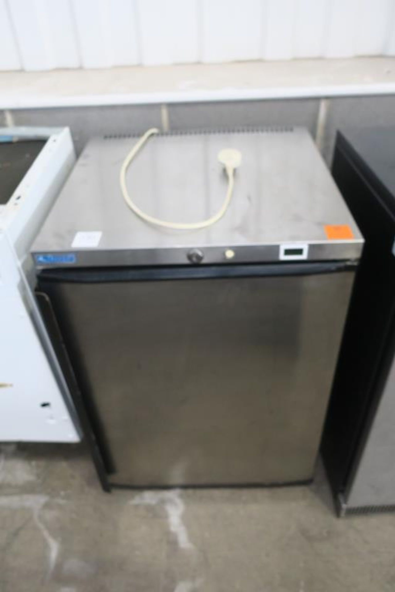 A Norpe Stainless Steel Under Counter Fridge Unit. Please note there is a £5 plus VAT Lift Out Fee