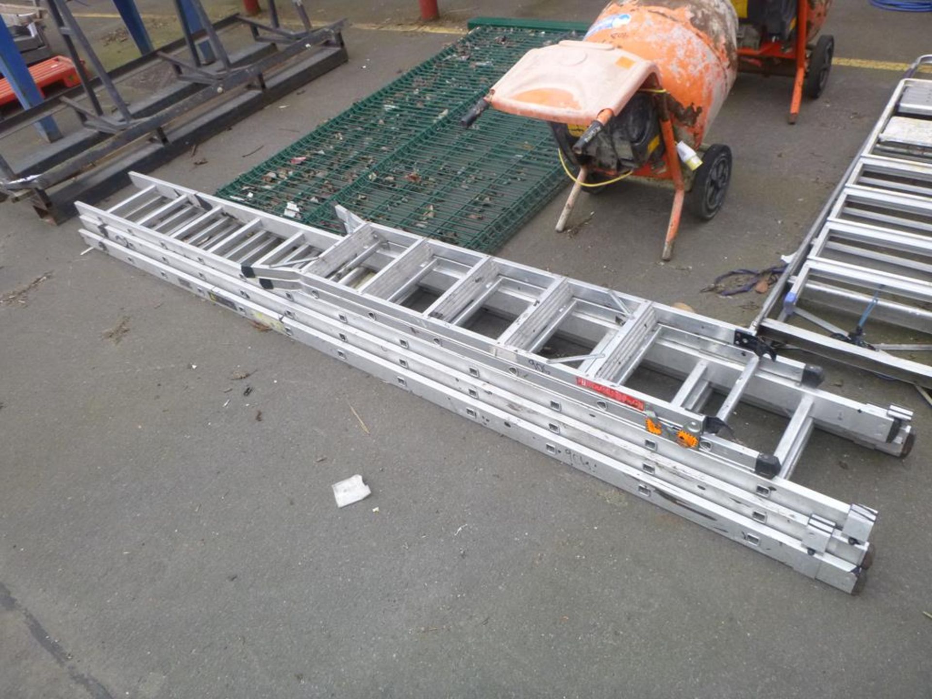 A Wickes Trade Triple 36 x Rung Extendable Ladder together with a 6 Rung Step Ladder