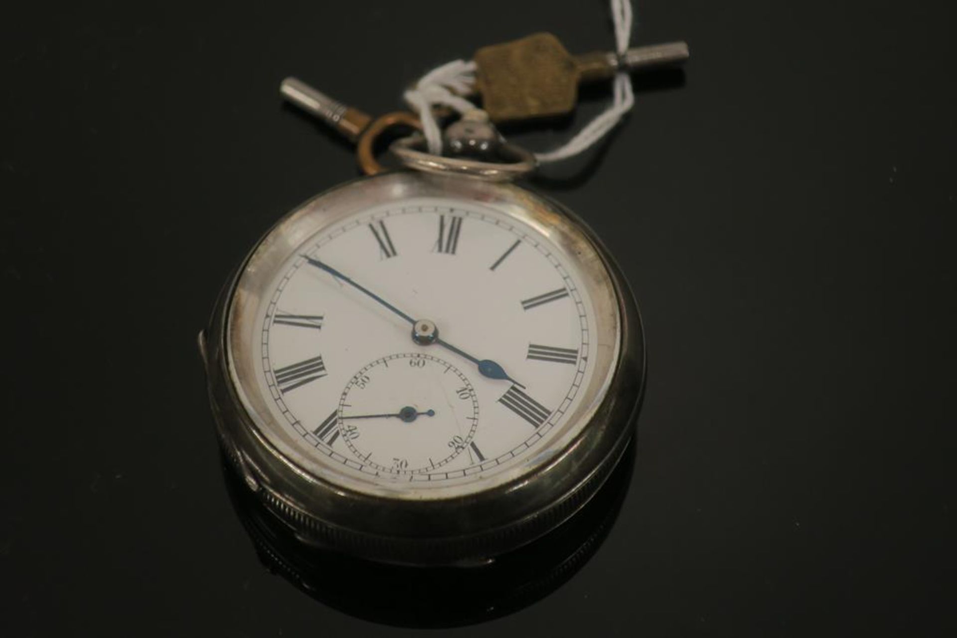 A Silver Pocket Watch with Winding Keys (est £25-£50)