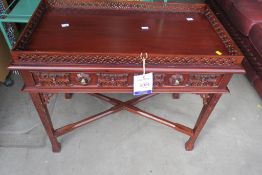 A Galleried Table with Ornately Carved Drawer Front and Panels (H72cm W88cm D50cm) (est £40-£80)