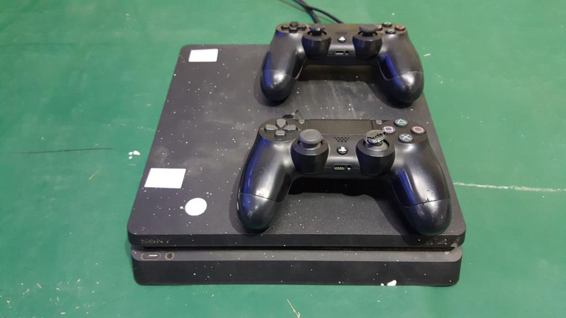 * A Playstation 4 Console (system reset) together with two controllers (a/f) and Fifa 18 (no box)